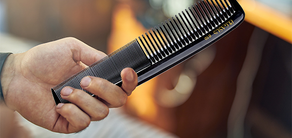 professional hair stylest useing a pegasus hard rubber comb